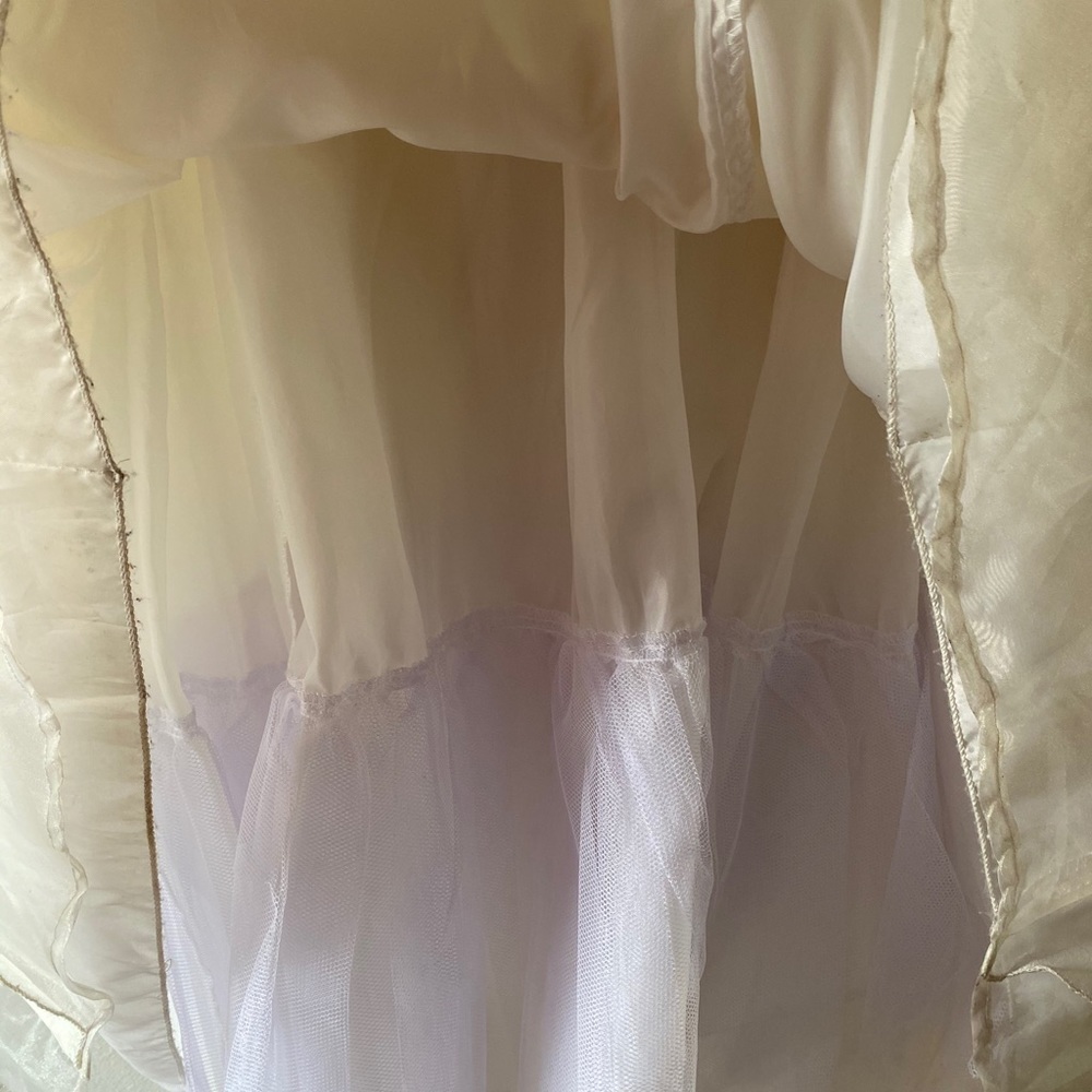 white a ivory dress with crown of flowers